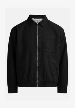 Black zip-up jacket with a collar, one chest pocket, two side pockets, and a soft, textured inner lining.
