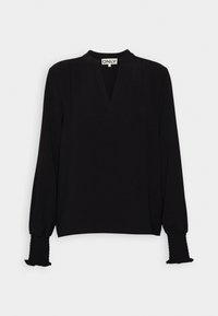 Mustassa pitkähihaisessa paidassa on V-pääntie, kerroksellista yksityiskohtaa olkapäissä sekä laskostetut hihansuut, joissa on röyhelöpäällyste. Kevyt, teksturoitu kangas.