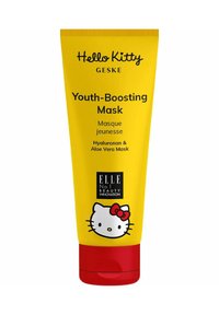 Tubo di maschera giovanile di colore giallo brillante con fondo rosso. Presenta un grafico di Hello Kitty e testo che indica ingredienti di acido ialuronico e aloe vera.