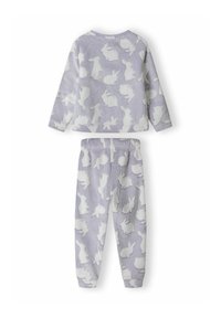 Tv�ådelat pyjamaset i ljuslila fleece, med ett mönster av kaniner i vitt. Toppen har raglanärmar och byxorna har elastisk midja.
