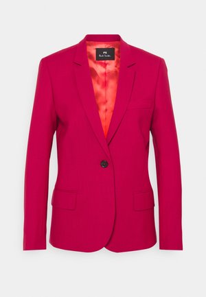 Bright pink tailored blazer with single black button, notched lapels, flap pockets, and red satin inner lining, front view.
