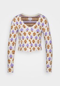 Häklad cardigan i krämfärgad med ett svampmönster i lila och brunt, med v-ringning, långa ärmar och fem vita knappar.