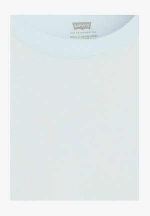 Encolure d'un t-shirt blanc Levi's montrant l'étiquette de la marque et les détails de fabrication à l'intérieur du col.