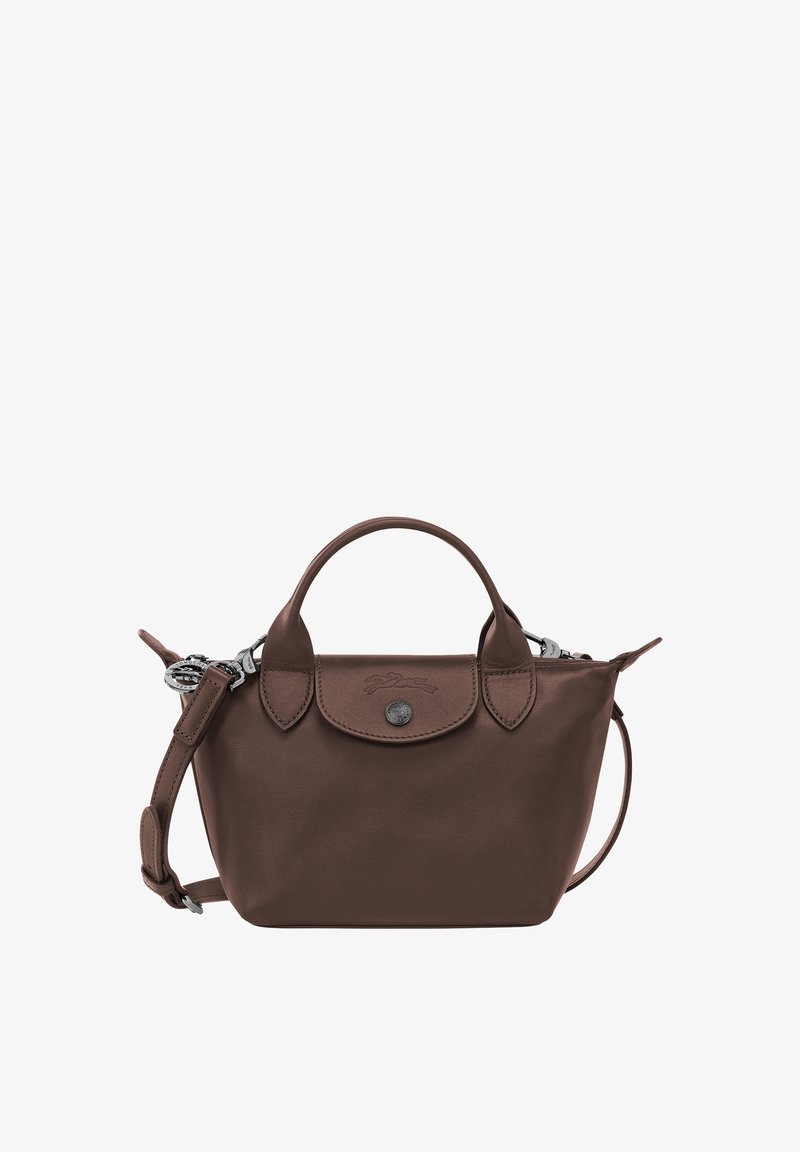 Brown leather handbag with top handles, a front flap with button closure, and an adjustable shoulder strap.