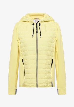 Lysegul hættejakke med lynlås, quiltet frontpanel, sort lynlås og snore, samt lynlåslommer i siderne.