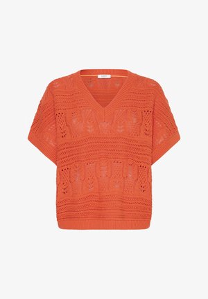 Oranssi lyhythihainen neulepusero, jossa on V-pääntie ja kukkainen pitsikuvio koko neuleessa.