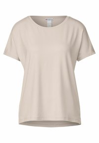 Beige kortärmad T-shirt i slät tyg, med rund halsringning och rak nederkant, med en avslappnad passform och utan synliga mönster.