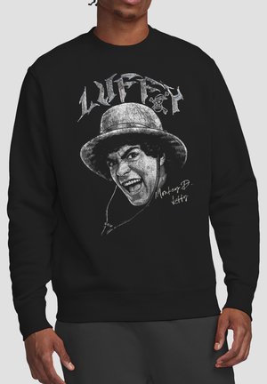 Black sweatshirt featuring a grayscale graphic of a smiling character wearing a bucket hat with "LUFFY" text and "Monkey D. Luffy" signature.