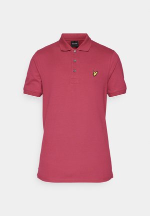 Cotton polo shirt in raspberry with a yellow embroidered logo. Features a collar, three-button placket, and short sleeves.