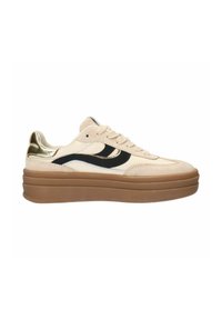 Beige suede sneakers with black and gold accents, thick brown sole, round toe, and lace-up closure. Textured upper and contrasting logo.