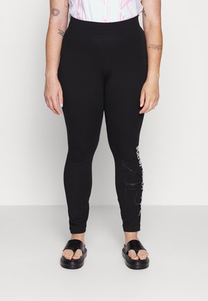 GLOSSY MONOGRAM - Leggings - Trousers - black