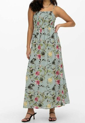Robe maxi en tissu léger et fluide ; vert menthe avec un motif floral comprenant des roses roses, jaunes et noires ; bretelles ajustables.