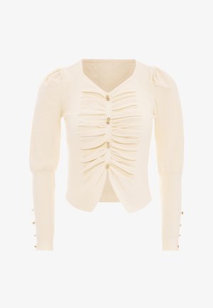 Cardigan en tricot crème avec un col en V, détail froncé à l'avant et boutons dorés. Présente des manches longues bouffantes avec des accents de boutons aux poignets.
