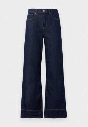 Dunkelblaue weit geschnittene Jeans aus Denim. Mit Knopfverschluss, Nähdetails und Seitentaschen. Ausgestellter Saum.
