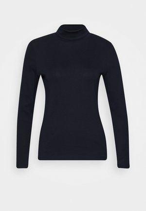 Haut noir à manches longues et col roulé ajusté avec une texture lisse, présenté sur un fond clair uni.