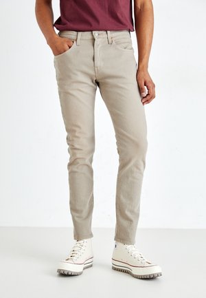 Vaqueros tapered - coloured denim