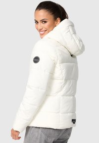 White puffer jacket with a hood, featuring a circular black brand logo on the left shoulder and horizontal quilted design.