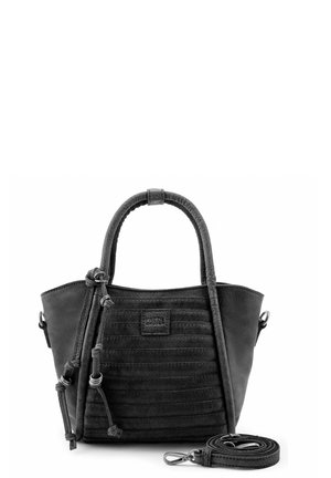 Sac à main en cuir noir avec un motif vertical cousu, deux poignées, des nœuds décoratifs et une bandoulière amovible enroulée à côté.