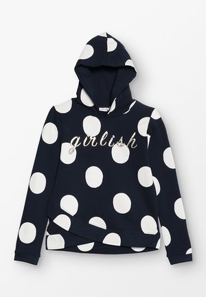 Navyblå hættetrøje med store hvide polkaprikker og "girlish" skrevet med glitrende skrift på brystet, lange ærmer og en forlomme.