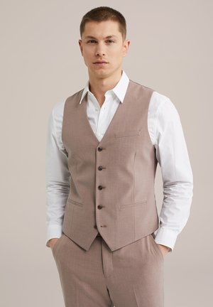 Light brown vest made of textured fabric, featuring a pointed hem, five buttons, and two side pockets, paired with a white collared shirt.