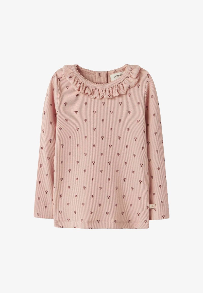 Ilgomis rankovėmis palaidinė, pagaminta iš rožinės tekstūros audinio su mažais tamsiai raudonais karštųjų oro balionų raštais ir volanga aplink kaklo plotą.