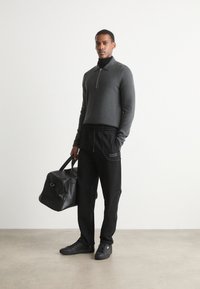 HUGO NIPIPEPANT - Tracksuit bottoms - black