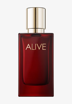 Rechteckige tiefrote Parfümflasche mit goldfarbenem Verschluss und dem Wort „ALIVE“ in goldenen Buchstaben auf der Vorderseite.