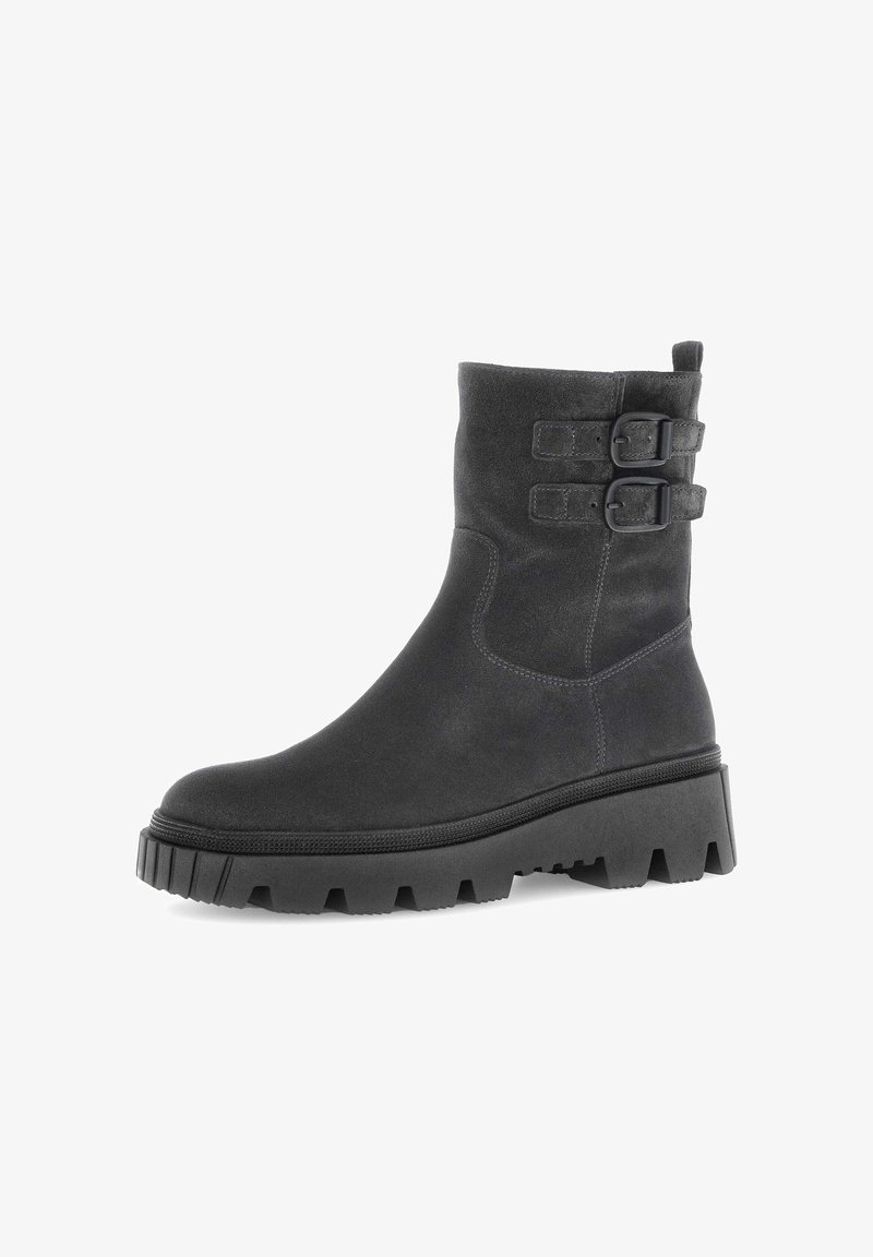 Black suede ankle boot with a chunky rubber sole, featuring two adjustable buckle straps and smooth texture.