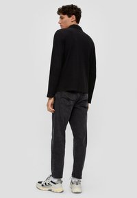 QS Poloshirt - schwarz