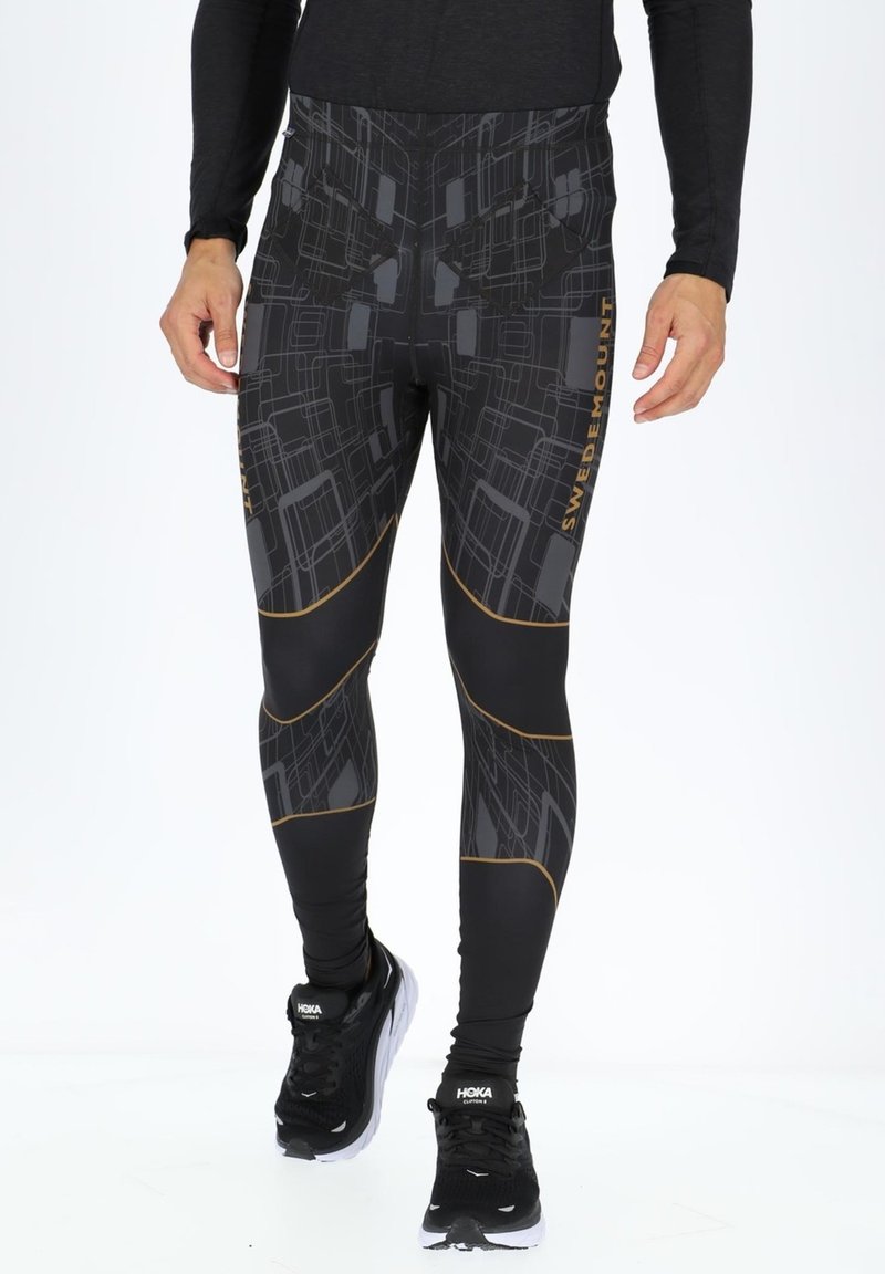 Schwarze Performance-Leggings mit geometrischem Muster, ausgestattet mit goldenen Akzenten und einem figurbetonten Design für sportliche Aktivitäten.