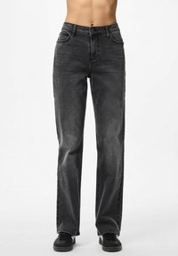 Black denim jeans with a straight-leg cut, featuring five pockets, a button waistband, and distressed detailing for texture.