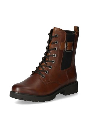 Botte chelsea en cuir marron avec fermeture à lacets, panneau latéral élastique noir, œillets en argent et semelle en caoutchouc noir robuste.