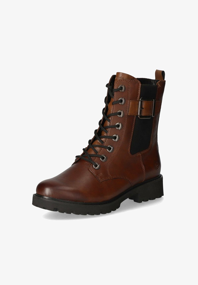 Brun läderankelsk boot med snörning, svart elastisk sidopanel, silveröglor och en slitstark svart gummisula.