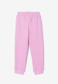 Pantalon de survêtement rose en tissu doux, avec une taille élastique et des poignets ajustés aux chevilles pour un ajustement confortable.