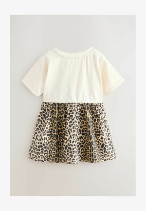 Kratka haljina s kratkim rukavima, kremaste boje na vrhu i suknjom s leopardskim uzorkom u nijansama smeđe i crne. Izrađeno od mekanog pamuka s naboranim strukom.