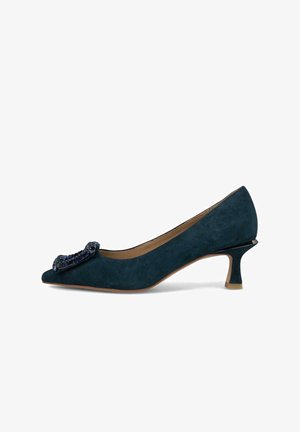 Marineblaues Wildleder-Pumps mit einer spitzen Fußspitze und einem dekorativen, mit Perlen verzierten Schleifenakzent an der Vorderseite. Stiletto-Absatz mit einer schwarzen Spitze.