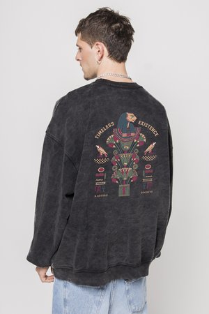 Sudadera negra de gran tamaño con un colorido gráfico en la parte posterior que presenta un diseño de aves y formas geométricas. Tejido de mezcla de algodón.