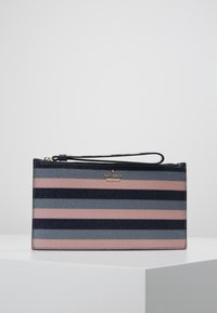 Striped clutch in navy, pink, and grey with a textured finish. Features a gold logo plaque and a wrist strap. Smooth zipper closure.