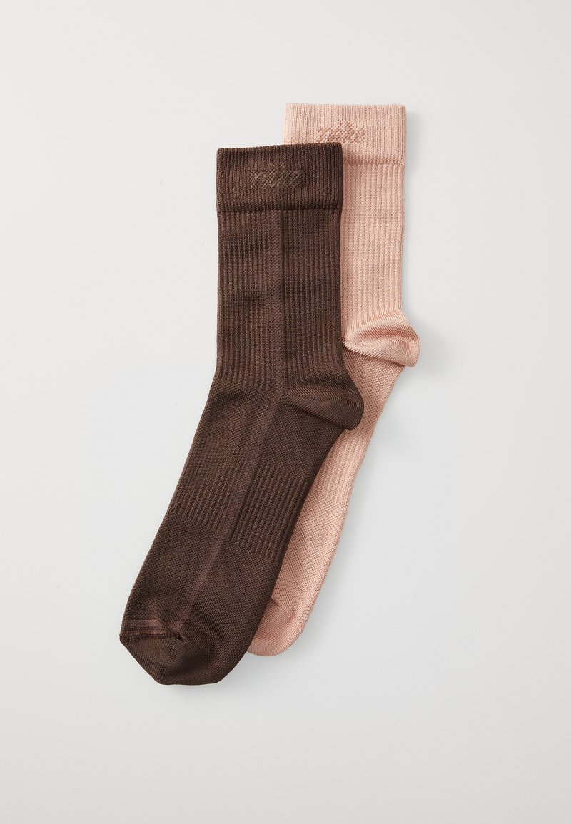 Two pairs of socks: one dark brown with a ribbed texture and the other soft pink with a smooth finish. Both feature knit cuffs.