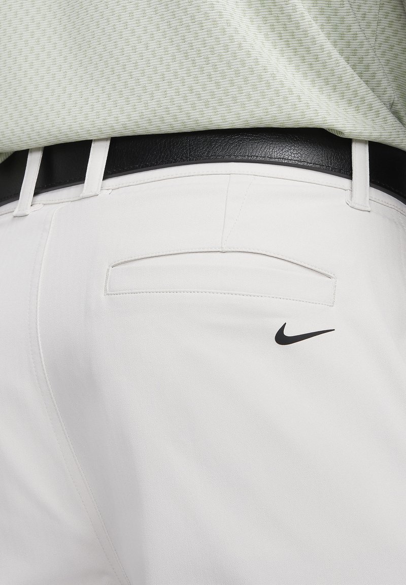 white nike golf pants