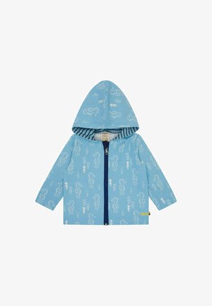 Giacca a zip azzurro chiaro con cappuccio, caratterizzata da motivi di cavallucci marini bianchi e bolle, e una fodera interna a righe. Realizzata in tessuto morbido.