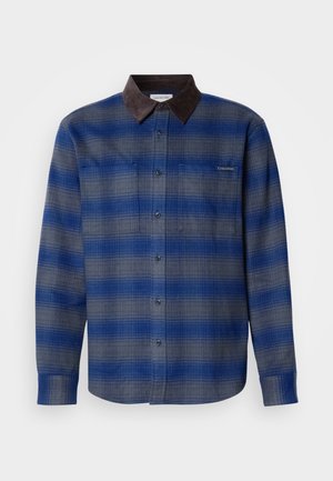 Blue and gray plaid shirt with a brown suede collar, long sleeves, button-up front, and two chest pockets. Subtle texture in fabric.