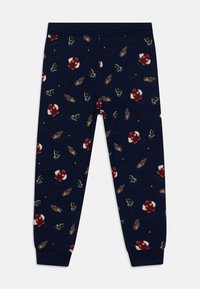 Marinblå leggings med en lekfull mönstring som föreställer fotbollshjälmar, tröjor och handskar. Tillverkade av mjukt, stretchigt tyg med en åtsittande design.