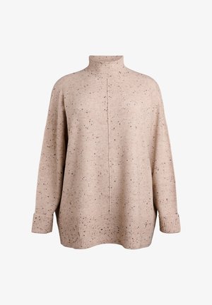 Pull beige en tissu texturé, avec un col montant, des épaules dénudées et une coupe ample. Motif moucheté et poignets côtelés.