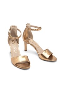 Sandali con tacco metallici dorati con cinturini alla caviglia, design open-toe e una texture morbida. Presentano un tacco modesto e una soletta con marchio.