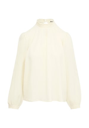 Crème-kleurige blouse met een hoge smockkraag, pofmouwen en elastische manchetten. De stof lijkt lichtgewicht en textuur te hebben.