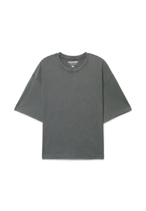 Maglietta oversize grigio scuro corta con maniche corte e scollo rotondo, taglia XL, distesa su sfondo bianco.