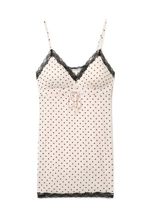 Vestito a spalline rosa chiaro con motivo a cuori neri, spalline sottili regolabili, rifinitura in pizzo nero sullo scollo e sull'orlo, e fiocco annodato sul davanti.