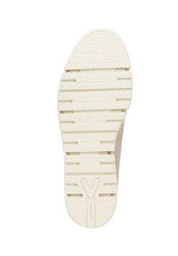 Suola di gomma bianca con modelli di grip testurizzati, caratterizzata da un prominente logo "V" e una indicazione circolare vicino al tallone.