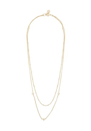 Guldtonad lagerhalsband med delikata kedjor, med hjärtaccent och spänne. Slät yta, lättviktig design.